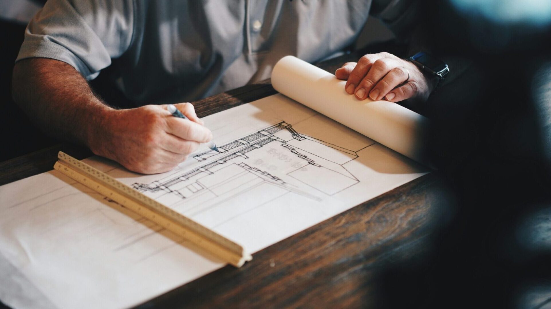 Property construction services. An architect designing a building.